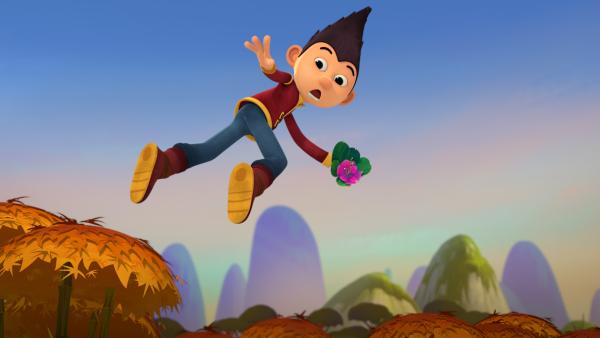 Bild 1 von 7: Tashi hat eine Bambusblüte gefunden.