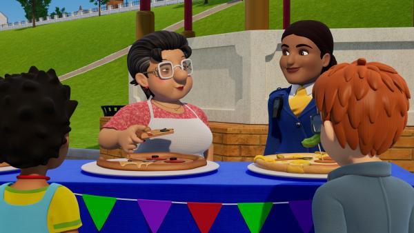 Bild 1 von 3: Jurorin Bella probiert die Pizzas, die die Back-Teams kreiert haben.