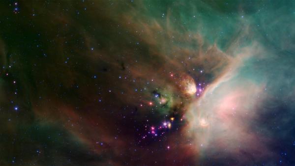 Bild 1 von 2: Auf diesem Bild treten neu entstandene Sterne aus einem Schleier von Sternenstaub und Gesteinsbrocken hervor. Auch unsere Sonne entstand aus interstellarer Materie - den Überresten einer Supernova-Explosion.