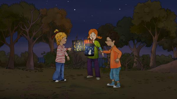 Bild 1 von 14: Conni, Anna und Simon mit den selbstgebastelten Laternen, die sie untereinander austauschen.