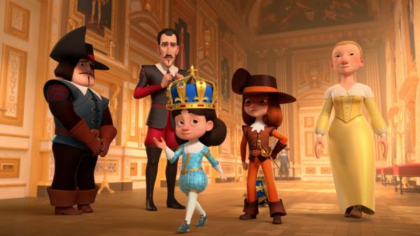 Bild 1 von 3: Der König (M.) ist froh, endlich seine richtige Krone auf dem Kopf zu tragen. Seine Gouvernante Constance (r.) und D'Artagnan (2.v.r.) freuen sich mit ihm. Richelieu (2.v.l.) ist es nicht gelungen den Diamanten aus der Krone zu bekommen und Rochefort (l.) hat es nicht geschafft, die echte Krone zurückzubringen.