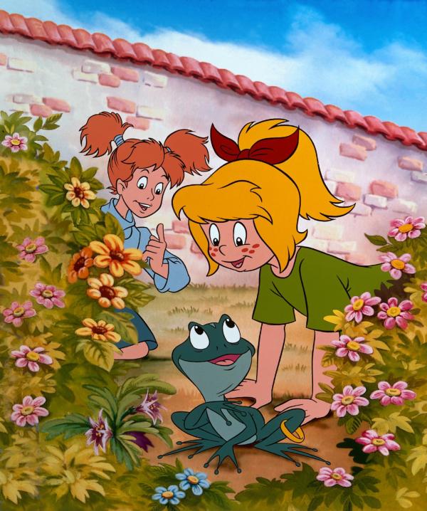 Bild 1 von 2: Bibi (l.) hat auf ihrem Schulweg einen Frosch gefunden. Ob sie ihn mit nach Hause nehmen soll?