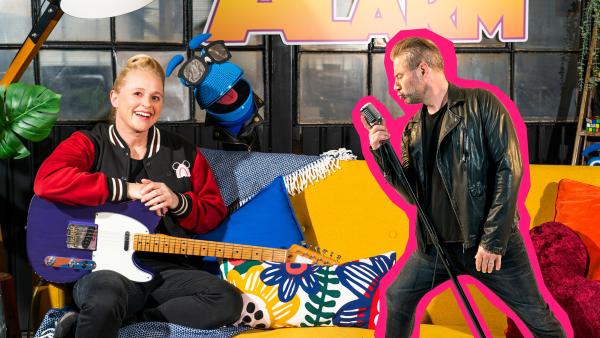 Bild 1 von 2: Singa und das SingDing sind im Rock'n'roll-Fieber! Mit Sasha haben sie einen echten Rockstar zu Besuch, der ihnen alle seine Tipps für einen starken Auftritt auf der Bühne verrät.