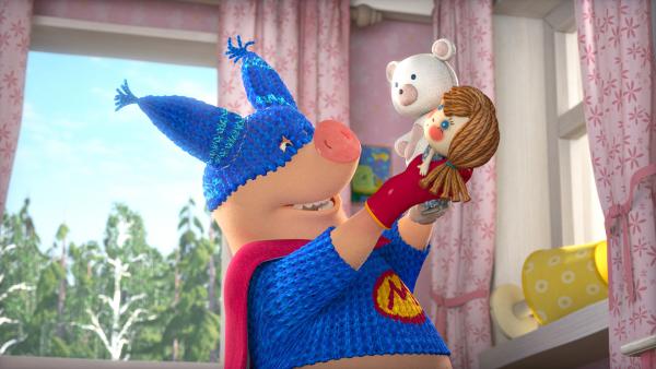 Bild 1 von 7: Das Superhelden-Schwein spielt mit Maschas Puppen.