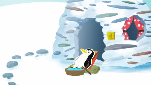 Bild 1 von 2: Lissy hat sich vor ihrem Steinhaus in die Sonne gelegt. Dieser Tag am Nordpol ist wirklich außergewöhnlich warm.