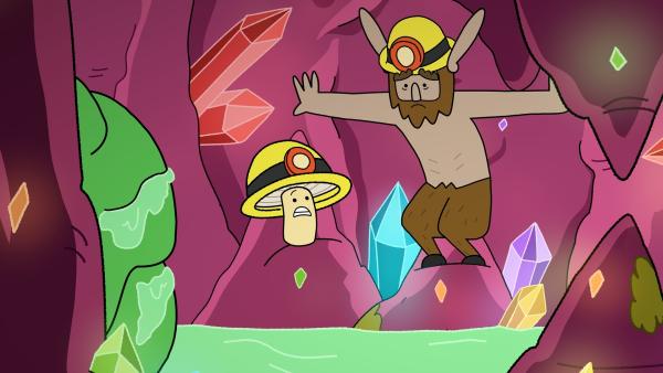 Bild 1 von 2: Tupfen (links) und Hufius (rechts) sind im hinteren Teil der Mine eingesperrt. Der grüne Hintern von Schmodda klemmt im Durchgang. Ohne Hufius Hilfe kommen die zwei da nicht raus, doch der hasst so eklige Sachen wie den Schleim.© ZDF/Tiger Aspect Kids & Family Limited, Movimenti Production, Zodiak Kids & Family France and Monello Productions 2025 - Honorarfreie Verwendung gemäß AGB im redaktionellen Zusammenhang mit genannter Sendung bei Nennung \