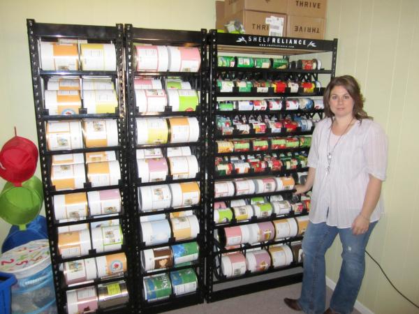 Bild 1 von 2: Tiffany Ivanovsky with stock pile.