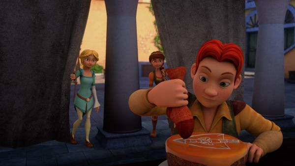 Bild 1 von 2: Lollo verziert eine Torte, Bianca (l.) und Lisa sehen zu.