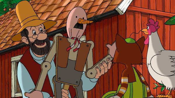 Bild 1 von 3: Pettersson (li.) zeigt Findus (re.) seine selbst gebaute Vogelscheuche, um die Kraniche zu vertreiben.