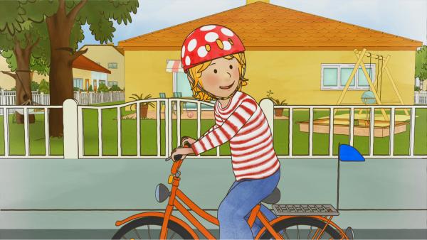 Bild 1 von 3: Conni kann endlich Fahrrad fahren. Schnell muss Conni ihre Fahrkünste ihrer Freundin Anna vorführen.