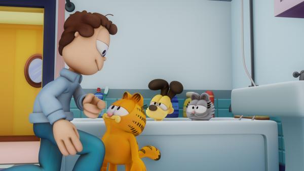 Bild 1 von 3: Weil Garfield, Odie und Nermal voller Schlamm sind, heißt es für die drei ab in die Badewanne.