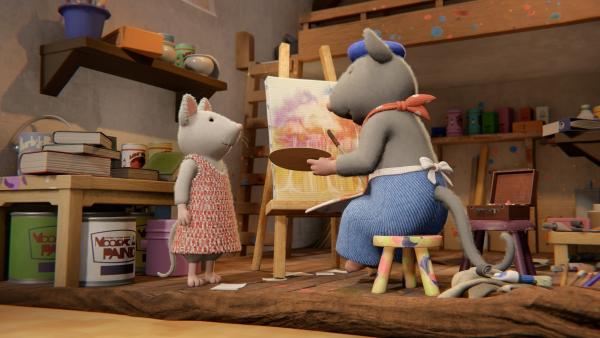 Bild 1 von 3: Julia (links) fragt Herrn Pallet (rechts), ob er ihr Material für ein Bild geben kann. Sie möchte Tonio helfen und für einen seiner Väter ein Bild zum Vatertag malen.