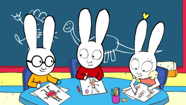 Bild 1 von 3: Im Klassenzimmer malen Ferdinand (l.), Simon (M.) und Lou (r.) Bilder. Simon zeichnet dabei Lou mit ihren Ohrringen. Plötzlich fällt Lou auf, dass sie ihren zweiten Ohrring nicht mehr hat.