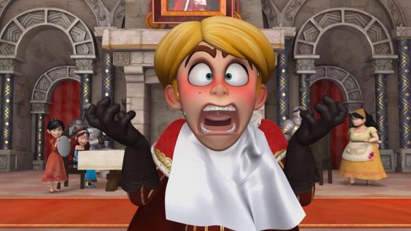 Bild 1 von 2: Prinz John läuft hochrot an und schreit bei seinem Essen plötzlich entsetzt laut auf. Scarlett hat ihm einen Streich gespielt und amüsiert sich mit Marian köstlich darüber.