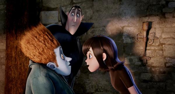 Bild 1 von 6: Johnnystein (Andy Samberg) and Mavis (Selena Gomez) with Dracula (Adam Sandler) looking on in HOTEL TRANSYLVANIA, an animated comedy from Sony Pictures Animation.