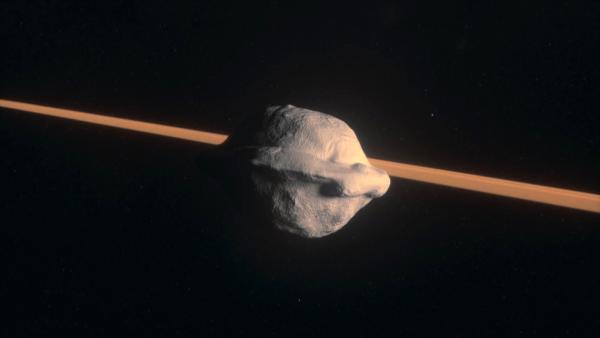 Bild 1 von 3: In den Saturnringen finden sich einige ungewöhnliche Objekte. Besonders auffällig ist der kleine Mond Pan, der an eine Walnuss erinnert.