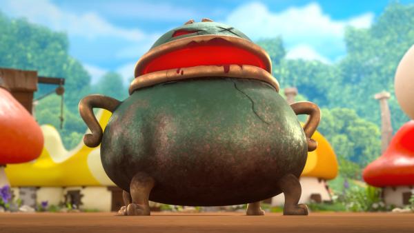 Bild 1 von 3: Papa Schlumpfs alter Zauberkessel ist zum Leben erwacht und droht nun, alle Schlümpfe in Gemüse zu verwandeln.