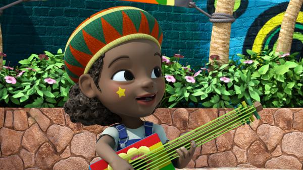 Bild 1 von 4: Shanna spielt auf ihrer alten Gitarre.