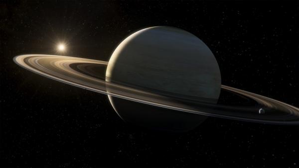 Bild 1 von 1: Weit hinter dem Jupiter liegt der Saturn. Der Planet mit seinen zahlreichen Monden und Ringen ist fast wie ein Miniatur-Sonnensystem.