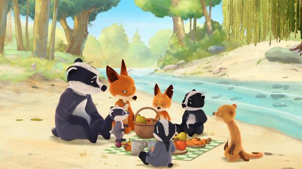 Bild 1 von 5: Die Familie macht ein Picknick am Bach.