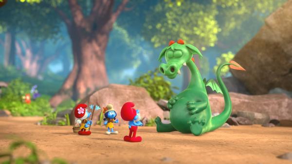 Bild 1 von 1: Drache Voltair hat aus Versehen Schlappi verschluckt, als dieser ihm Blaubeeren geschenkt hat. Nun müssen Papa Schlumpf und Schlumpfhilde einen Weg finden, Schlappi zu befreien.