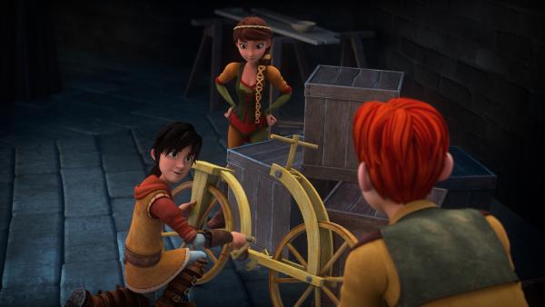 Bild 1 von 3: Leo, Lisa und Lollo begutachten Leos Fahrrad.