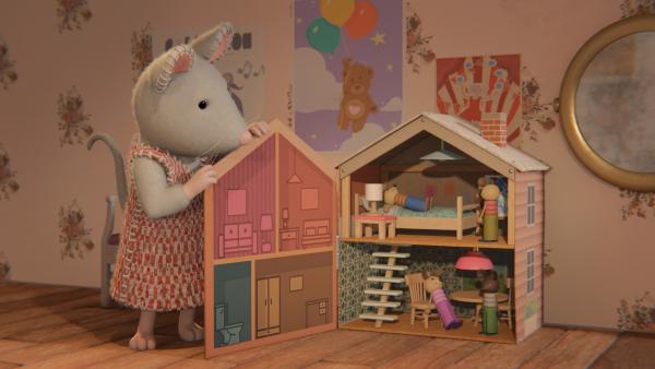 Bild 1 von 3: Julia ist zu Besuch bei ihrer Freundin Ella und darf mit deren Puppenhaus spielen.