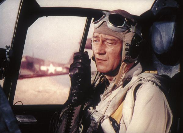 Bild 1 von 2: John Wayne als beinharter Jagdflieger Kirby.
