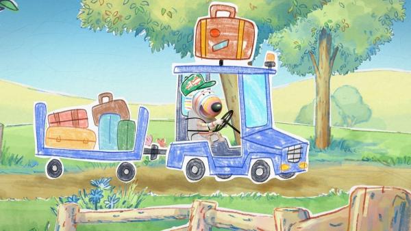 Bild 1 von 3: Dylan hat sichtlich Spaß als Flughafenmitarbeiter und bringt mit seinem Gepäckwagen das Gepäck der Fluggäste zum Gate.