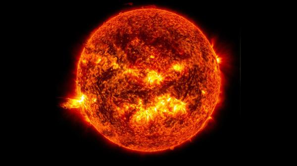 Bild 1 von 3: Diese Aufnahme der Solar Dynamics Observatory Mission der NASA zeigt das helle Licht einer Sonneneruption auf der linken Seite der Sonne.