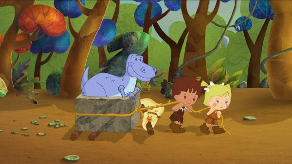 Bild 1 von 6: QuackQuack, Finn und Zoé zeigen dem Dinosaurier wie man schwere Dinge auf die leichte Art transportieren kann.