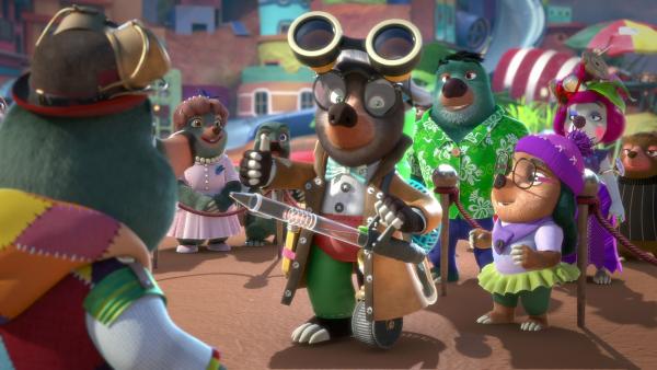 Bild 1 von 3: Gleich wird Onkel Mischmasch seine neueste Erfindung, den Verjüngonator X 2000, dem Publikum vorstellen. Mit diesem Gerät kann er alte Gegenstände in ihren ursprünglichen Neuzustand verwandeln.© ZDF/Two Daughters Entertainment Ltd 2022 - Honorarfreie Verwendung gemäß AGB im engen inhaltlichen redaktionellen Zusammenhang mit genannter Sendung bei Nennung \