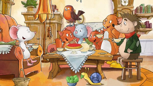 Bild 1 von 16: Tilda und ihre Freunde sitzen zusammen bei Tee und Kuchen.