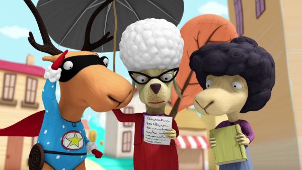 Bild 1 von 3: Edgar, Gerlinde und Marion studieren die Schatzweissagung.
