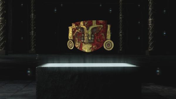 Bild 1 von 2: Die auffällige Maske mit goldener Nasenklemme und kunstvoll verzierten Ohrringe misst 18 mal 11 Zentimeter. In der Mitte der ungewöhnlich geformten Augen befinden sich Perlen aus poliertem Bernstein und Smaragden.