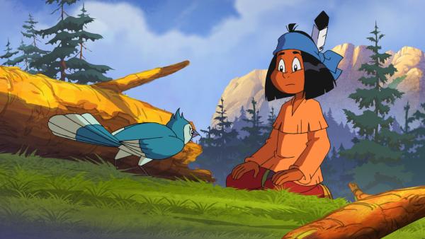 Bild 1 von 3: Als Yakari endlich einen Blauhäher entdeckt, ist dieser nicht ohne Weiteres bereit, Yakari seine Federn zu überlassen. Er stellt dem Jungen drei Aufgaben. Für jede, die Yakari löst, bekommt er eine Feder.