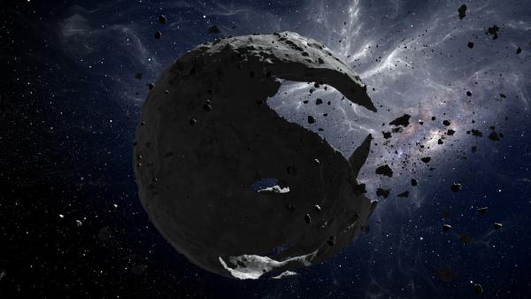 Bild 1 von 6: Ein zerstörter Planet als Sinnbild der Ungewissheit: Könnte das Zusammenspiel von Dunkler Materie und Dunkler Energie am Ende sogar über das Schicksal des Universums entscheiden?