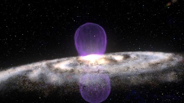Bild 1 von 2: Zwei riesengroße Gammastrahlen-Blasen ragen senkrecht aus dem Zentrum unserer Galaxis hinaus. Wie sind sie entstanden?