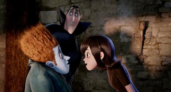 Bild 1 von 6: Johnnystein (Andy Samberg) and Mavis (Selena Gomez) with Dracula (Adam Sandler) looking on in HOTEL TRANSYLVANIA, an animated comedy from Sony Pictures Animation.