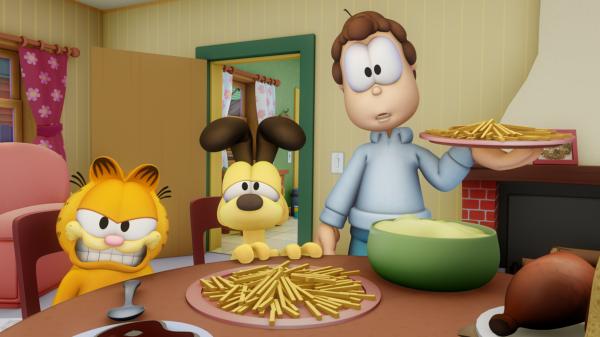 Bild 1 von 3: Jons Besuch futtert Garfield das Essen weg.