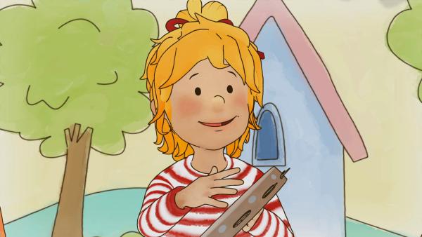 Bild 1 von 3: Conni hat sich das Tamburin ausgesucht. Darauf will sie ihren einstudierten Rhythmus spielen.