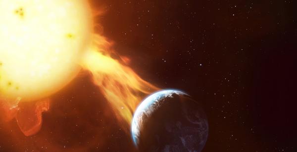 Bild 1 von 2: Treffen die geladenen Teilchen des Sonnensturms das Magnetfeld der Erde, stören sie unser Funksystem und können ganze Kontinente lahmlegen.
