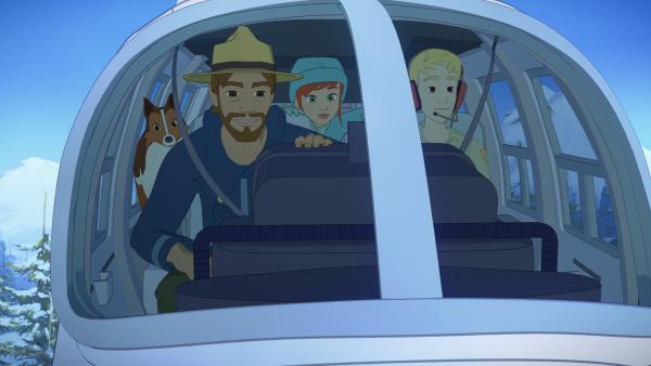 Bild 1 von 4: Zoé (M.) und Lassie dürfen Graham (l.) und den Piloten (r.) auf dem Beobachtungsflug begleiten.