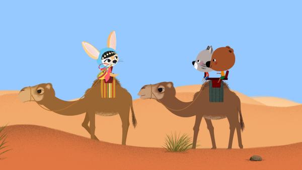 Bild 1 von 4: Mouk und Chavapa sind in Afrika, in der Sahara. Zusammen mit ihrer Freundin Aischa wollen sie zu einem Musikfestival mitten in der Wüste.