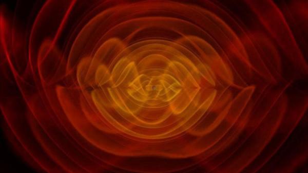 Bild 1 von 2: Dieses Bild der NASA zeigt eine Simulation von Gravitationswellen, entstanden durch die Kollision zweier Schwarzer Löcher.