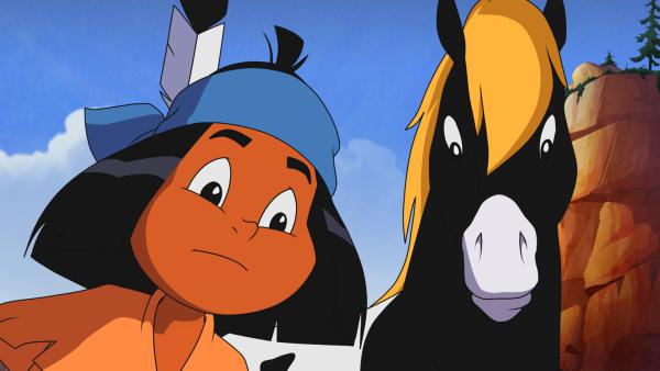 Bild 1 von 4: Yakari versucht die Spuren zu lesen, die im Felslabyrinth zu sehen sind.