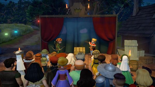 Bild 1 von 3: Die Dorfbewohner schauen dem Theaterstück zu, bei dem Prinz John die Hauptrolle als großen Helden spielt.